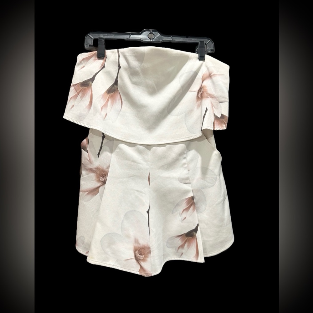 White romper with pockets. Off the shoulder, zipper back.